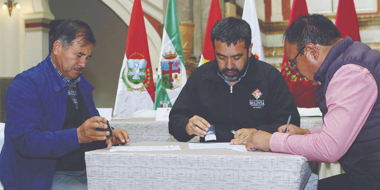 La firma del acta de acuerdos en el Palacio Quemado. 